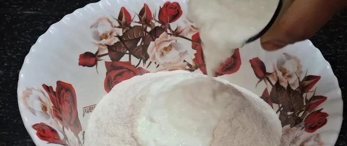 Gradually add water and knead into a soft, pliable dough, similar to chapati dough.
