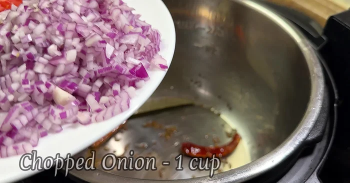 Add chopped red onion and salt. Sauté for 1-2 minutes until translucent.