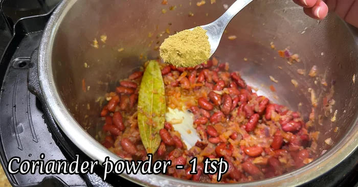 Add coriander powder, cumin powder, red chili powder, turmeric powder, and garam masala.