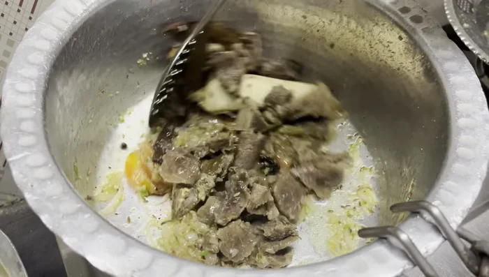 Add beef and spices: Add the shredded beef to the sautéed onions and aromatics. Stir in ginger-garlic paste, green chilies and mix well. Add salt.