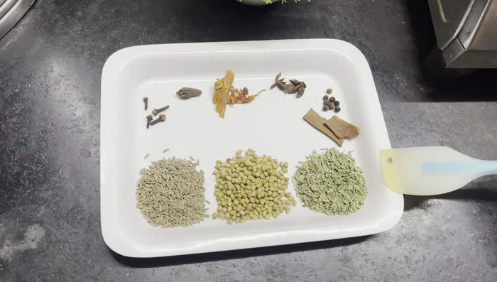 Boil the beef: In a cooker, add beef, prepared whole garam masala, one medium onion, four green chilies, three to four bay leaves, salt, and water. Cook until the beef is tender. (Add ginger-garlic paste after the beef starts to boil).