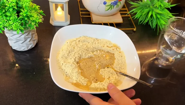 Add water gradually to the batter to achieve a thick, yet pourable consistency.