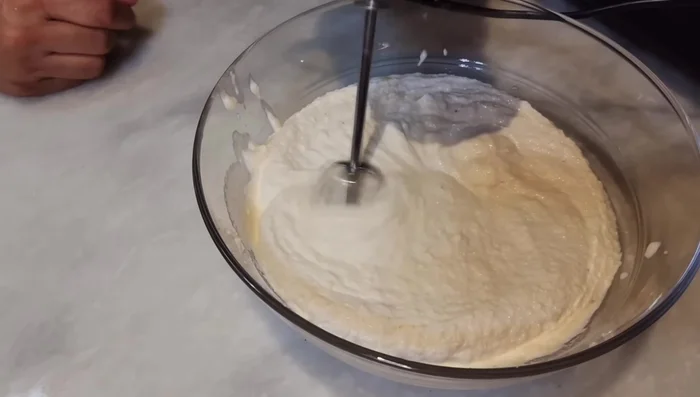 Beat the lentil batter vigorously for 2-3 minutes to incorporate air. (This makes the bhalle fluffy)