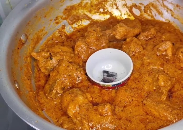 For smoky flavor, heat coal, add butter/oil/ghee in a bowl, place bowl on top, and cover for 5 mins.