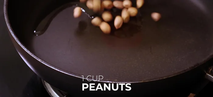 Roast peanuts in a pan with oil until slightly browned. Add coriander and cumin seeds; roast until golden brown. Cool completely.