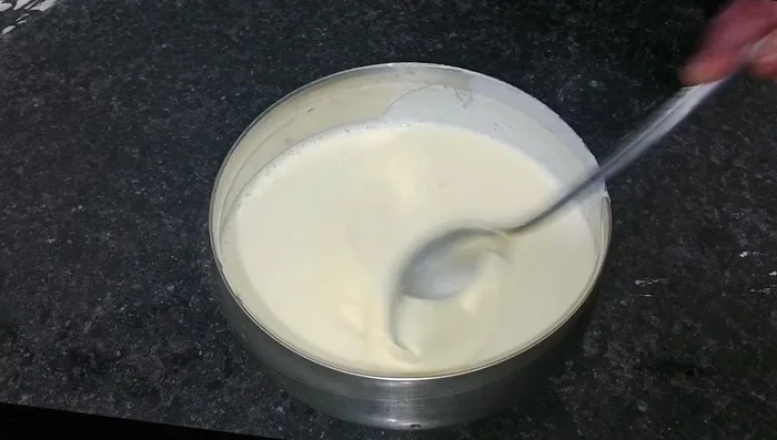 Add baking soda (or Eno fruit salt) and salt to the idli batter. Let it rest overnight.