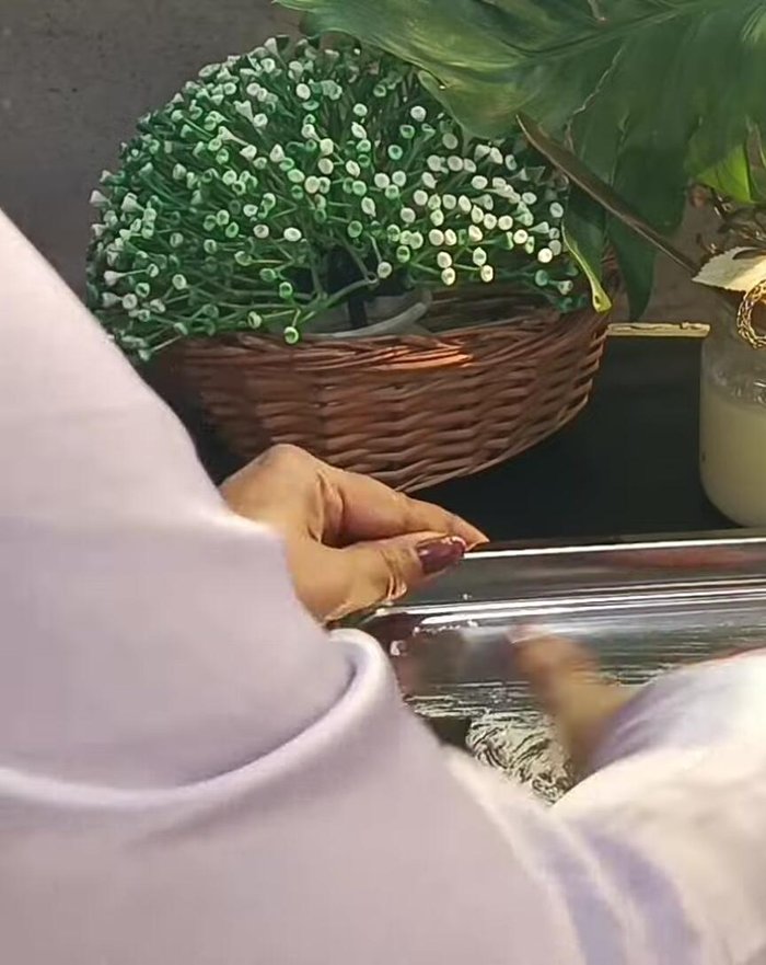 Set and Cool: Grease a tray with ghee. Pour the coconut-mawa mixture into the tray, spread evenly, and let it cool and set for 10 minutes.