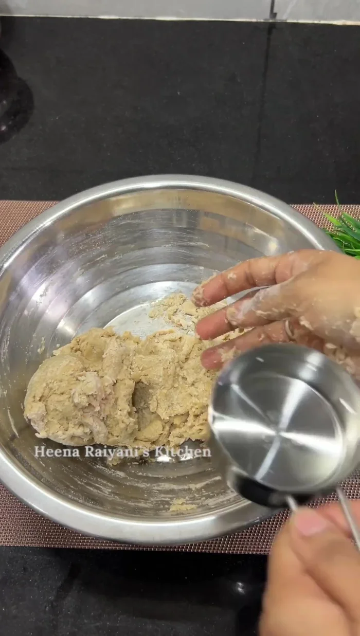 Gradually add warm water or milk, kneading until a smooth, sticky dough forms. Knead for 5-7 minutes. (159.68)