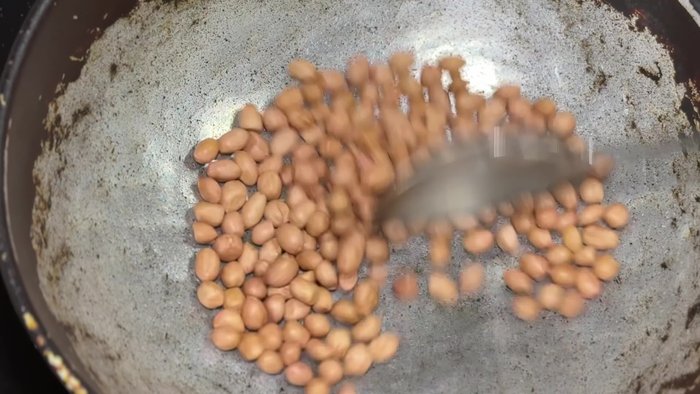 Roast half a cup of peanuts until medium brown. Let them cool and grind into a powder using a mixer.