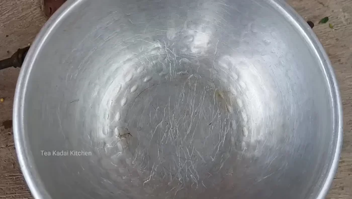 In a separate pot, bring the tamarind soaking water to a boil. Add turmeric powder and simmer.