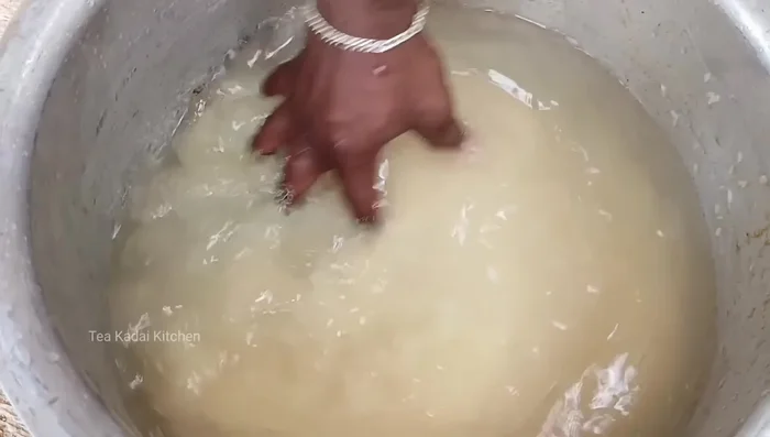 Wash and soak the rice twice, then soak it a third time in water.