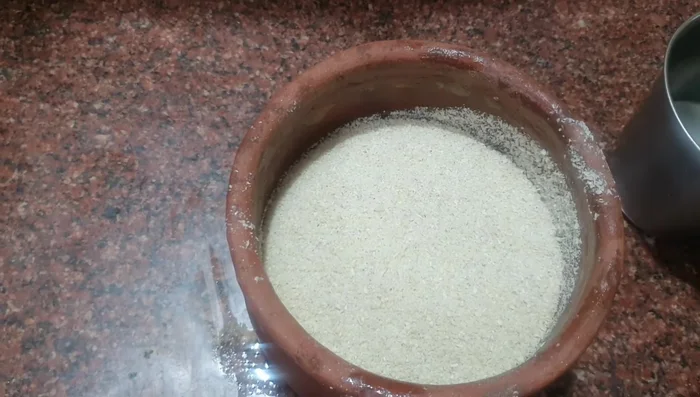 Add the corn flour to a pot. Mix with enough water to create a batter. Let it ferment for 8 hours (or overnight). Cover the pot with a damp cotton cloth to help with fermentation.