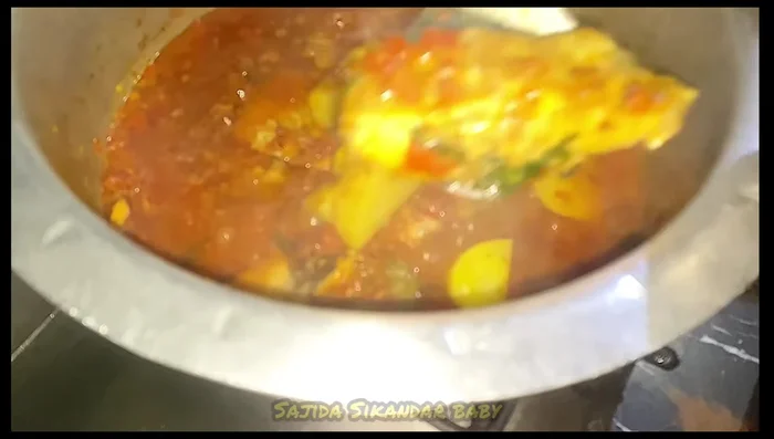 Gently remove the cooked fish from the curry.