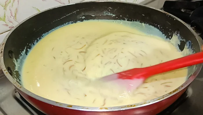Increase heat and bring to a boil. Add dry coconut and sugar.