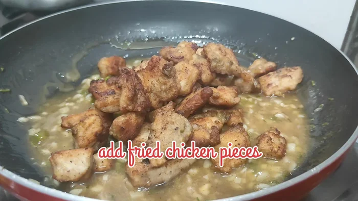Combine and finish: Add the fried chicken pieces to the sauce. Mix well. Add fresh cream (optional) and stir.