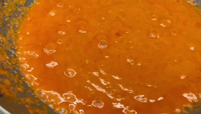 Simmer the sauce after adding yogurt and fenugreek.