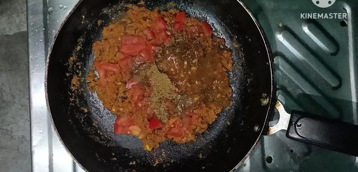 Add a little water and cook until the tomatoes melt completely.