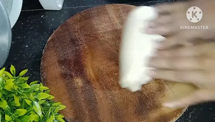 Prepare the dough balls: Divide the dough into small balls and roll them into thin puris using dry flour to prevent sticking.