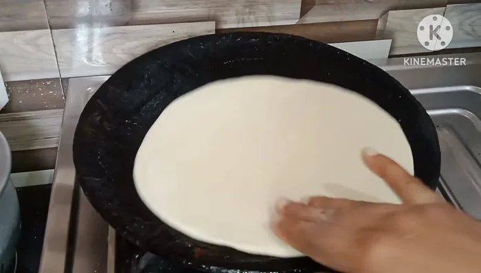 Cook the rotis: Cook the rotis on medium-low heat in a pan with oil, turning occasionally until lightly browned and crispy.