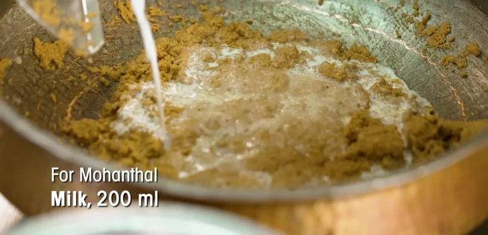 Add milk to the roasted gram flour mixture, stirring until well combined. (474.319)