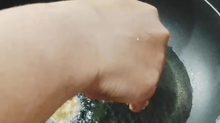 Heat oil in a pan over medium heat.