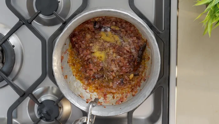 Add salt to help release more water from the onions (140.319). Continue cooking until onions are lightly roasted (154.12).