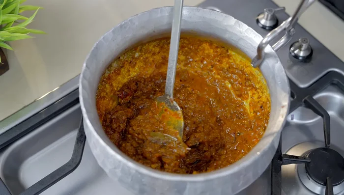 Add water as needed to prevent sticking (252.599). Stir frequently until a paste forms (263.16).