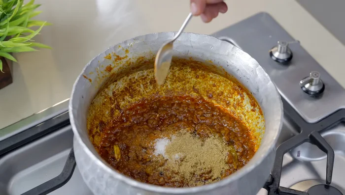 Increase the heat. Add salt, coriander powder, and chicken masala. Cook briefly (281.68).