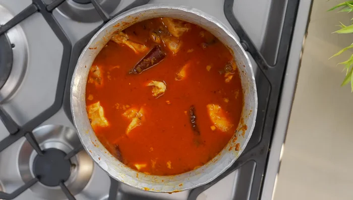 Add water, bring to a boil, then reduce heat to low. Cover and simmer for 15 minutes with a weight on top (351.08).