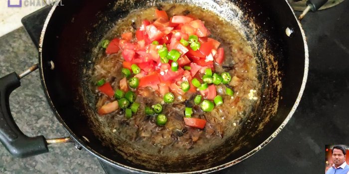 Add finely chopped tomatoes, green chilies, salt, red chili powder, turmeric powder, coriander powder, cumin powder, and black pepper powder (optional). Mix well and cook for 1-2 minutes.