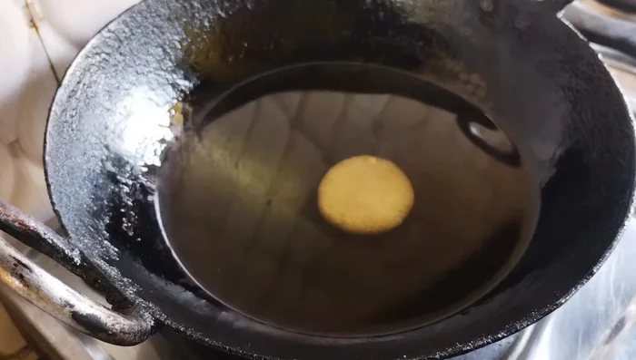 Heat oil in a pan on low heat until it shows slight bubbles. Fry the biscuits until golden brown, turning carefully to cook both sides evenly. This takes about 5-6 minutes per batch.