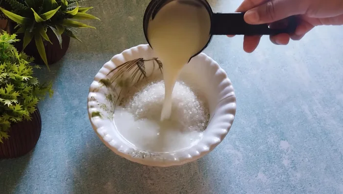 Add ½ cup hot milk (or hot water) to the sugar and mix for 1-2 minutes. Set aside.