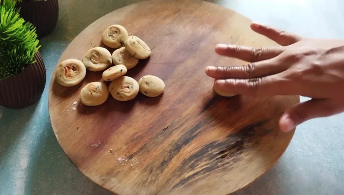 Press each piece slightly in the middle to flatten them.