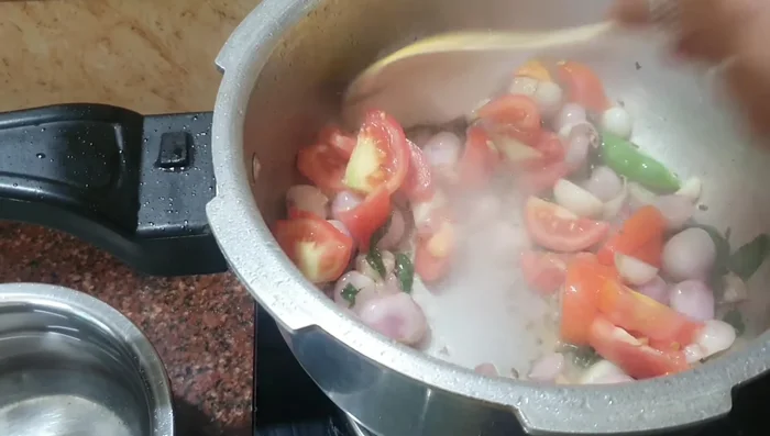 Add tomatoes and sauté until slightly softened. Add ginger.