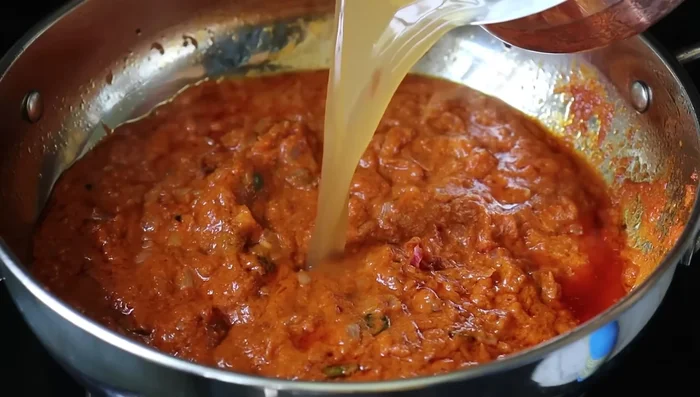 Add ginger-garlic paste, green chilies, turmeric powder, chili powder, and coriander powder. Sauté for a minute.