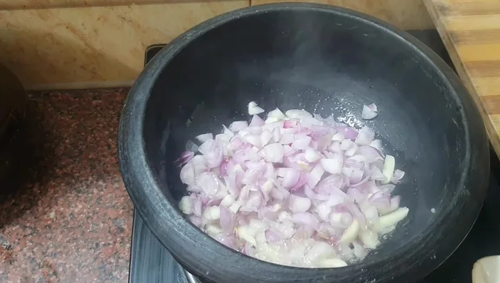 Add chopped garlic and fry until slightly browned.