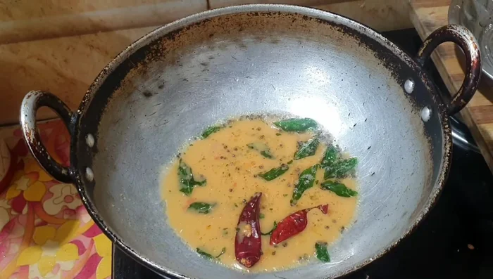 In a mixie jar, add the ground chutney, fried spices, 3 tbsp water, and jaggery. Blend until smooth.