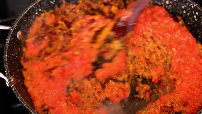 Add tomatoes and cook until softened.