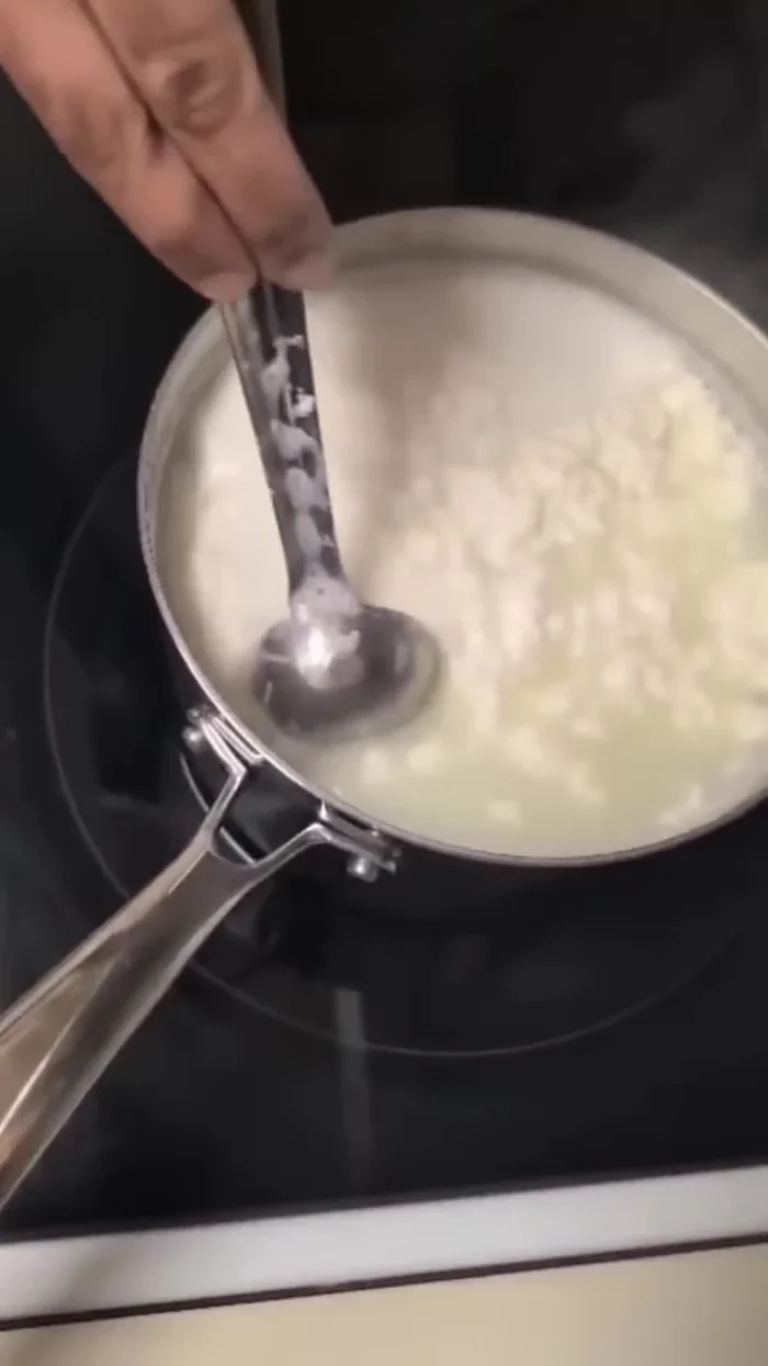 Transfer the separated paneer and whey to a vessel.