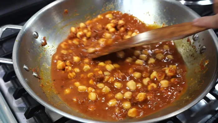 Add 1 cup of hot water. Blend the saved chickpeas with 1/2 cup of water into a smooth paste.