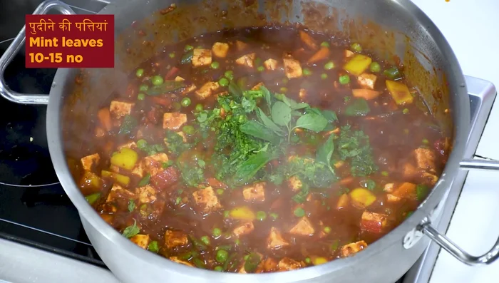 Add chopped coriander and mint leaves. Stir in 1 cup of curd to reduce the spiciness.