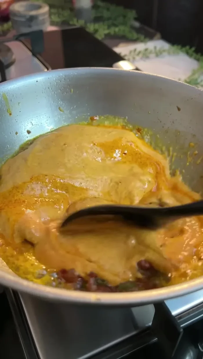 Add the curd mixture, and cook until oil separates.