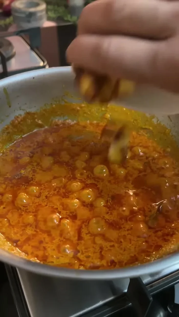 Add the fried paneer and mix well.