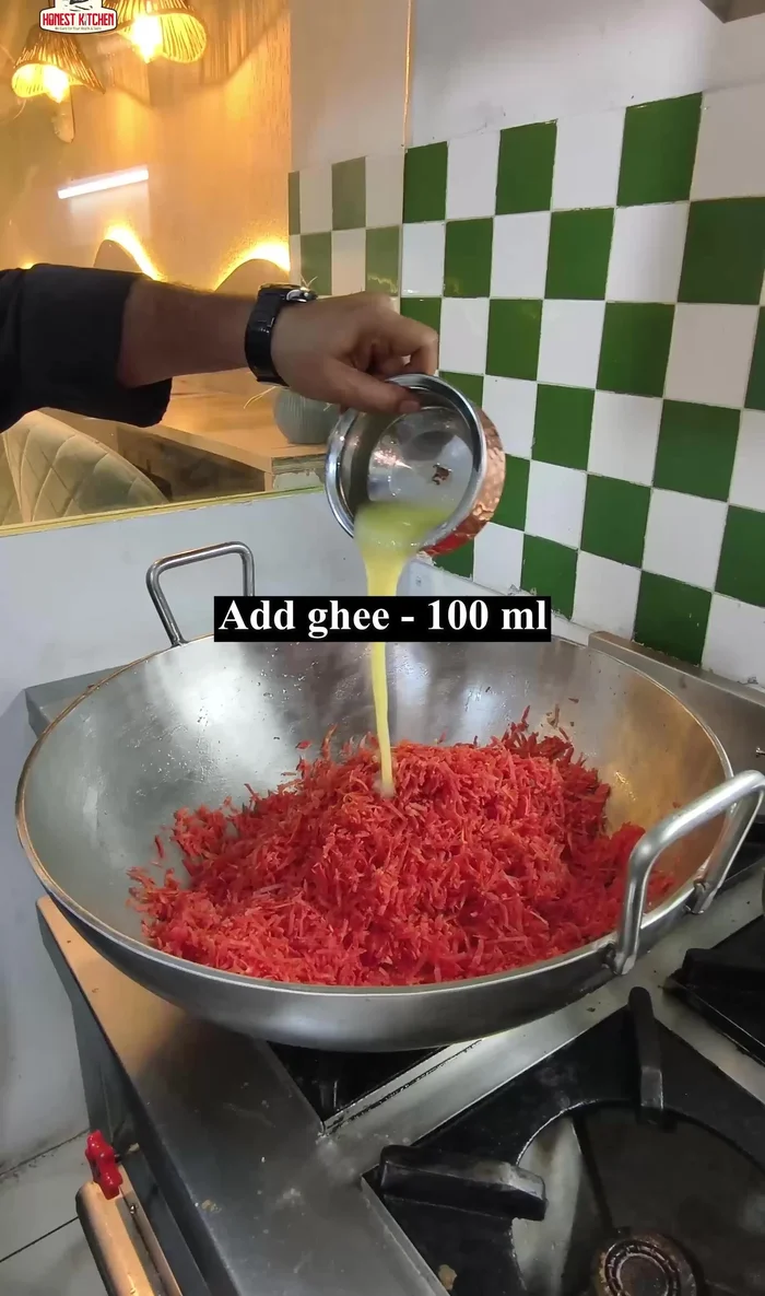 Add the carrots and 100ml of ghee, and roast over high heat.