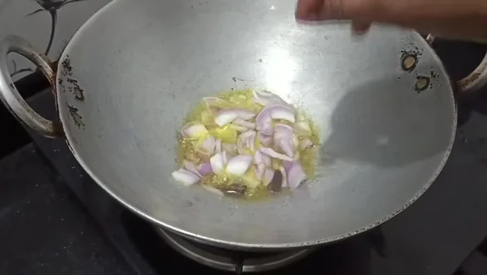 Add finely chopped onion and fry until golden brown.