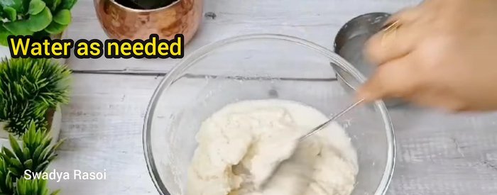 Gradually add water, mixing until a thick batter forms.