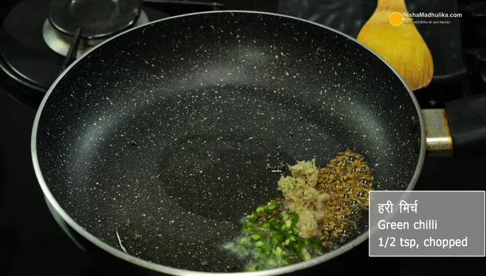 Add chopped tomatoes, turmeric powder, red chili powder, coriander powder, salt, and curry leaves. Fry lightly.
