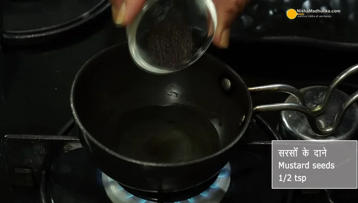 Heat oil in a pan for the chutney tempering, add mustard seeds, curry leaves and red chilies. Add to the chutney.