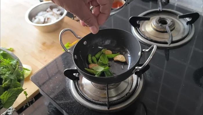 Fry until the chilies blister slightly.