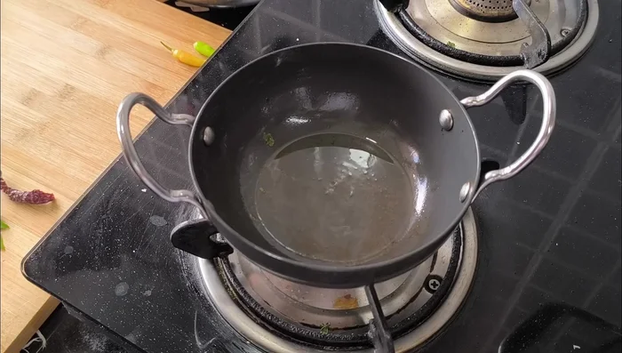 For tempering: Heat 1 teaspoon of oil. Add 1 dried red chili, a few curry leaves, and a pinch of hing (asafoetida).